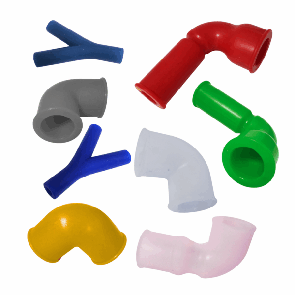 A collection of colourful resil recycled silicone products from Silclear including a dark blue silicone Y connector, red silicone elbow bend, grey, clear and yellow bends, a green elbow bend, a light pink elbow bend and a blue Y connector
